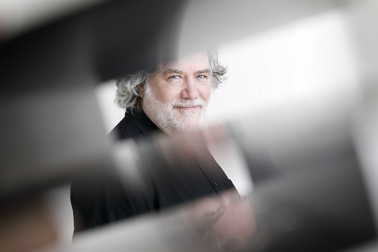 A portrait photo of a person is shown. 