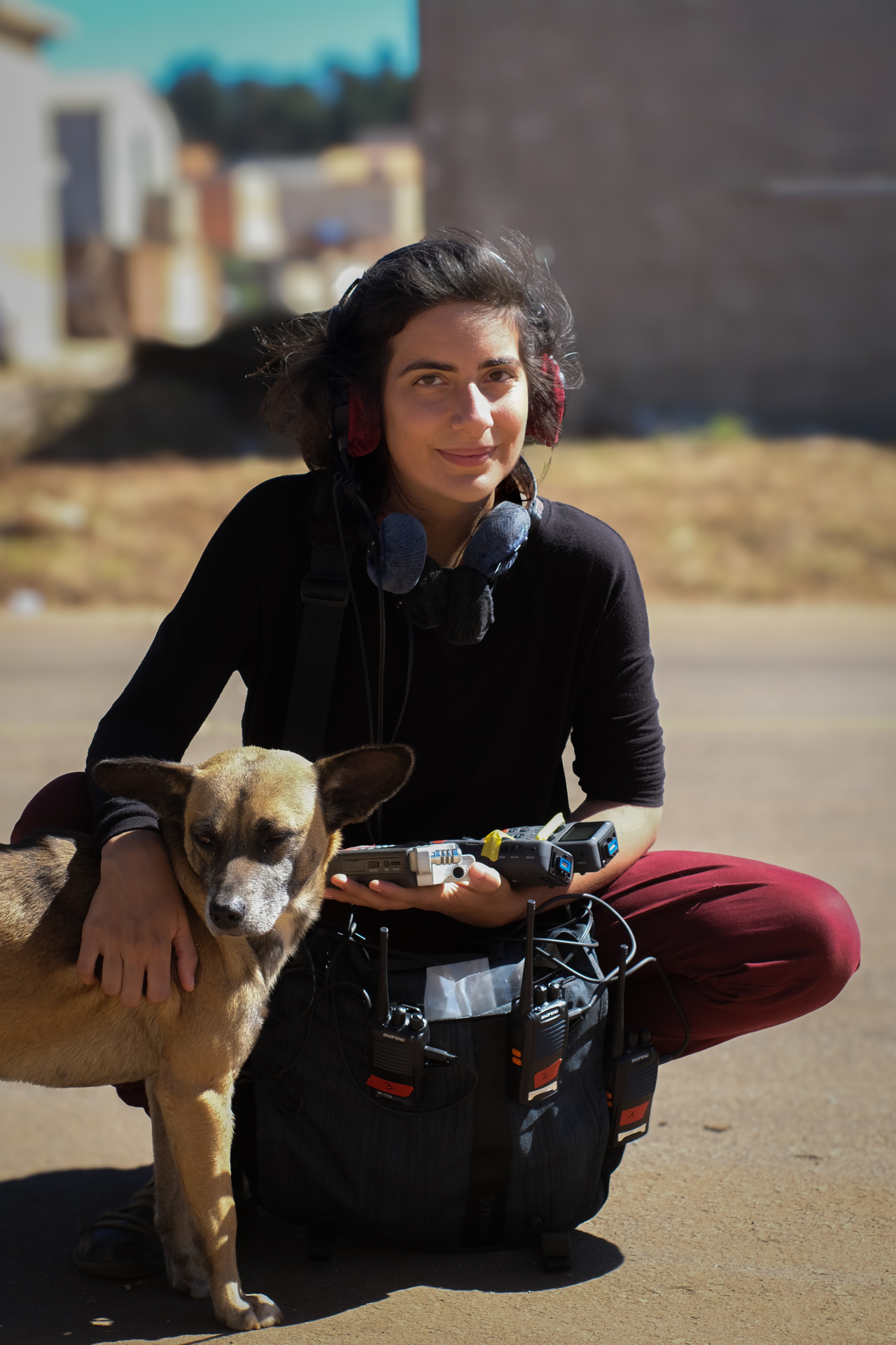 The portrait photograph shows a person with a dog. 
