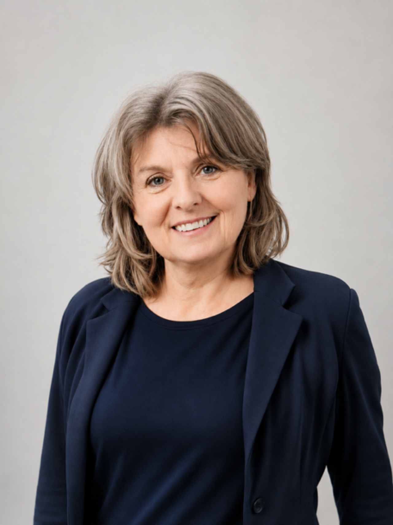 Zu sehen ist das Portraitfoto einer Person. 
