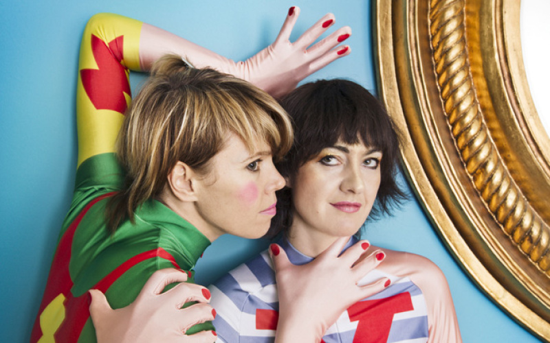 Two woman in colored costumes