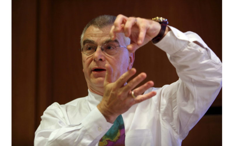 Close-up of György Buzsáki talking and gesticulating.