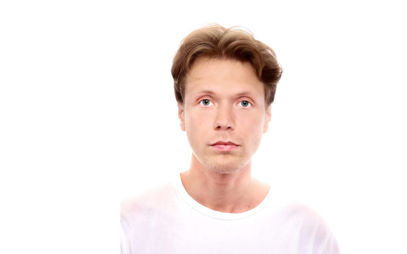 The portrait shows Russian artist Vasiliy Sumin in white T-shirt.