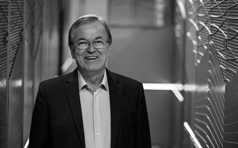 A portrait photo of Thomas Lippert is shown. 