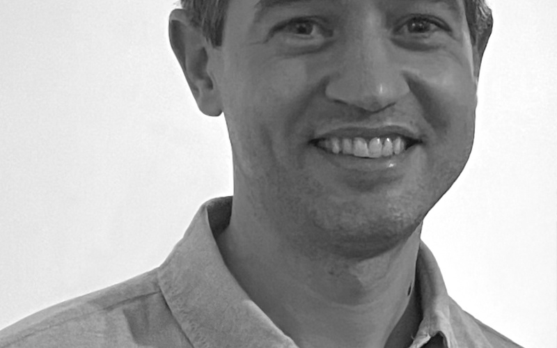 A portrait photo of Paul Galloway is shown. 