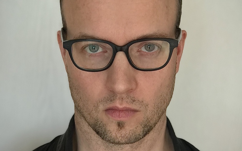 A portrait photo of Moritz Lobeck is shown. 