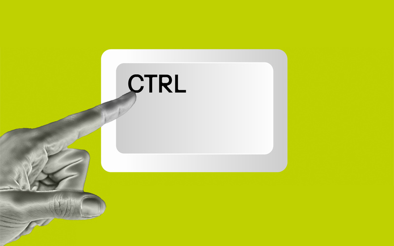 The image shows a silver hand pointing to the letters “CTRL.”