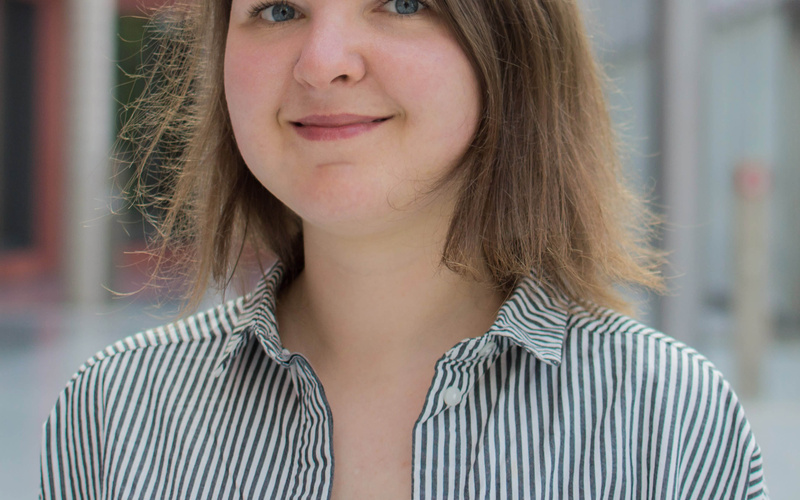 A portrait photo of a person is shown. 