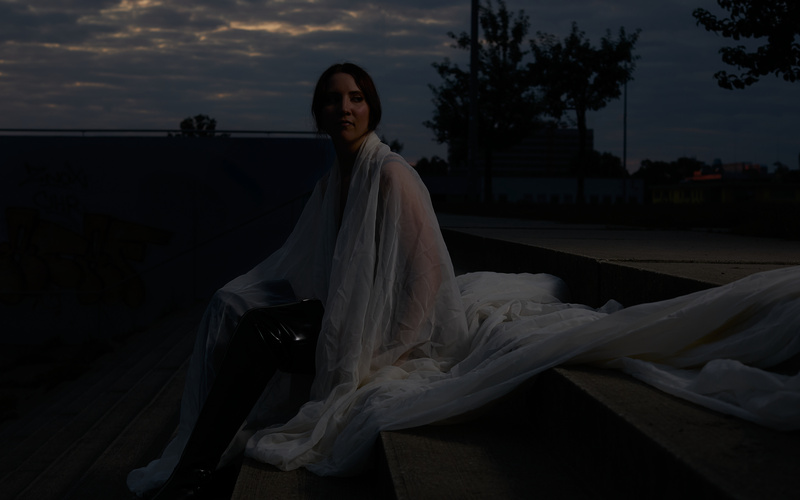 A portrait photo of a person is shown. 