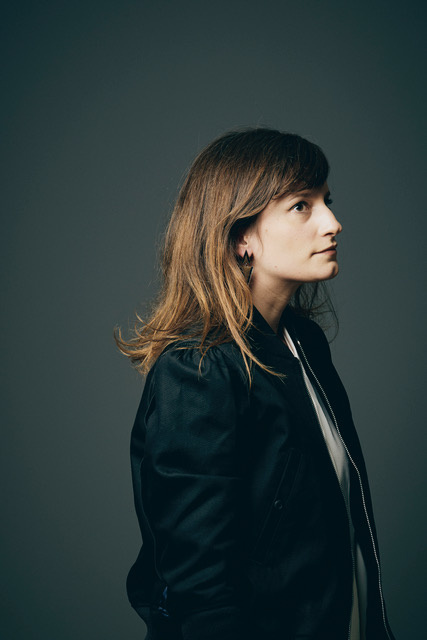 A woman called Justine Emard can be seen from the side.
