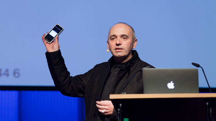 Man raising a mobile phone