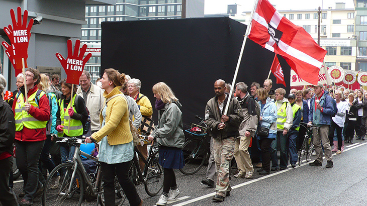 A demonstration where people carry a black box