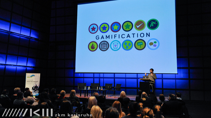 People hearing a speach about "gamification"