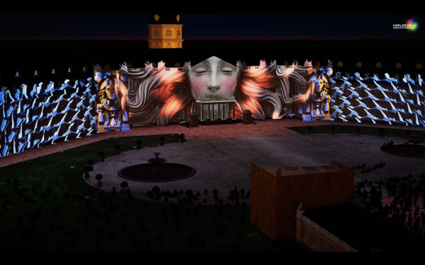 Auf der Karlsruher Schlossfassade ist ein Projection Mapping zu sehen, das in der Nacht leuchtet. 