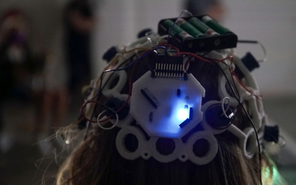 You can see a person with a wired helmet on his head.