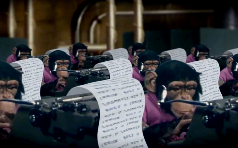 Chimpanzees sit at typewriters