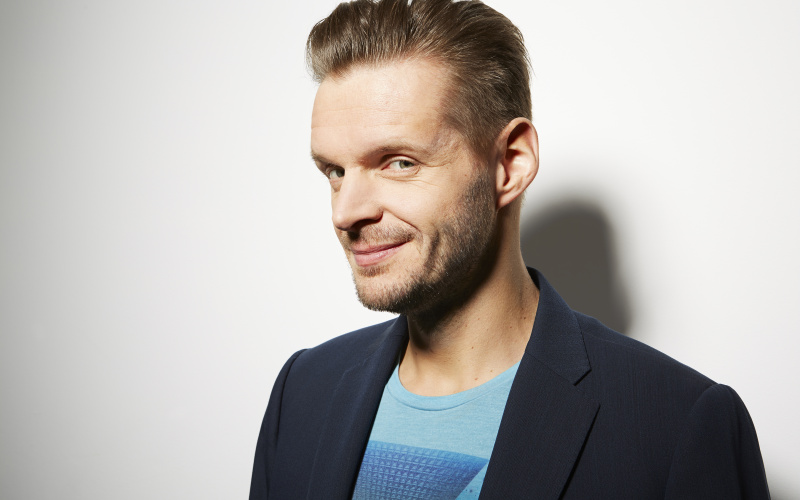 A man laughing at the camera