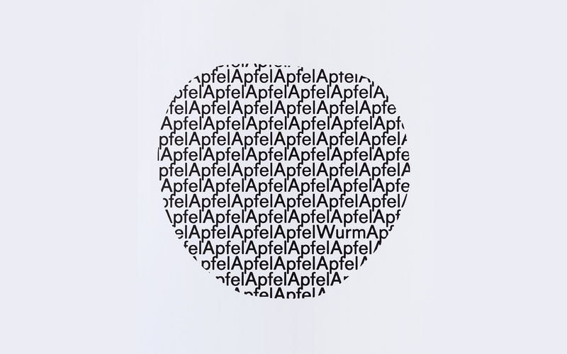Die Form eines Apfels bestehend aus den Wörtern «Apfel« und dem Wort «Wurm«.