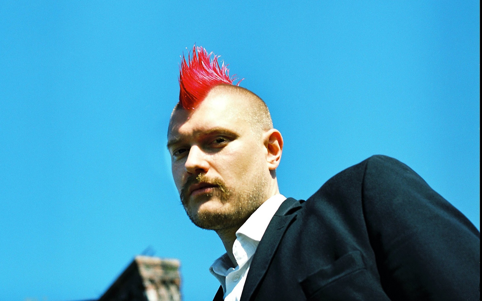 A man with a red mohawk