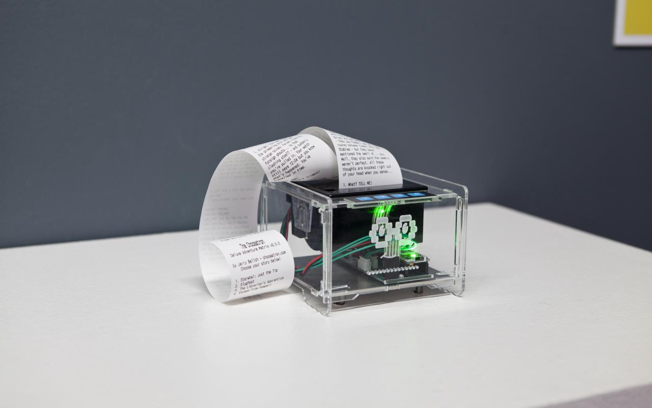A see-through printer prints on a long piece of paper