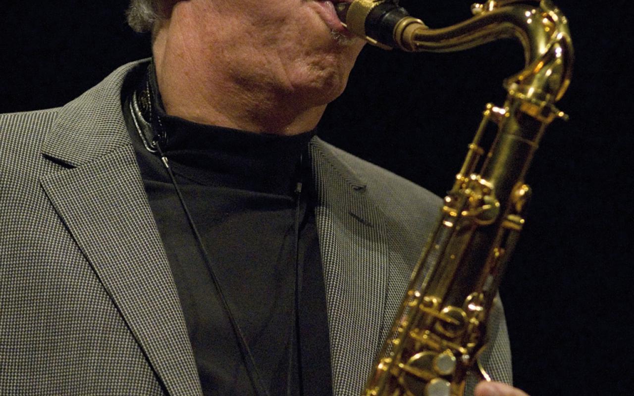 A man playing the saxophone.