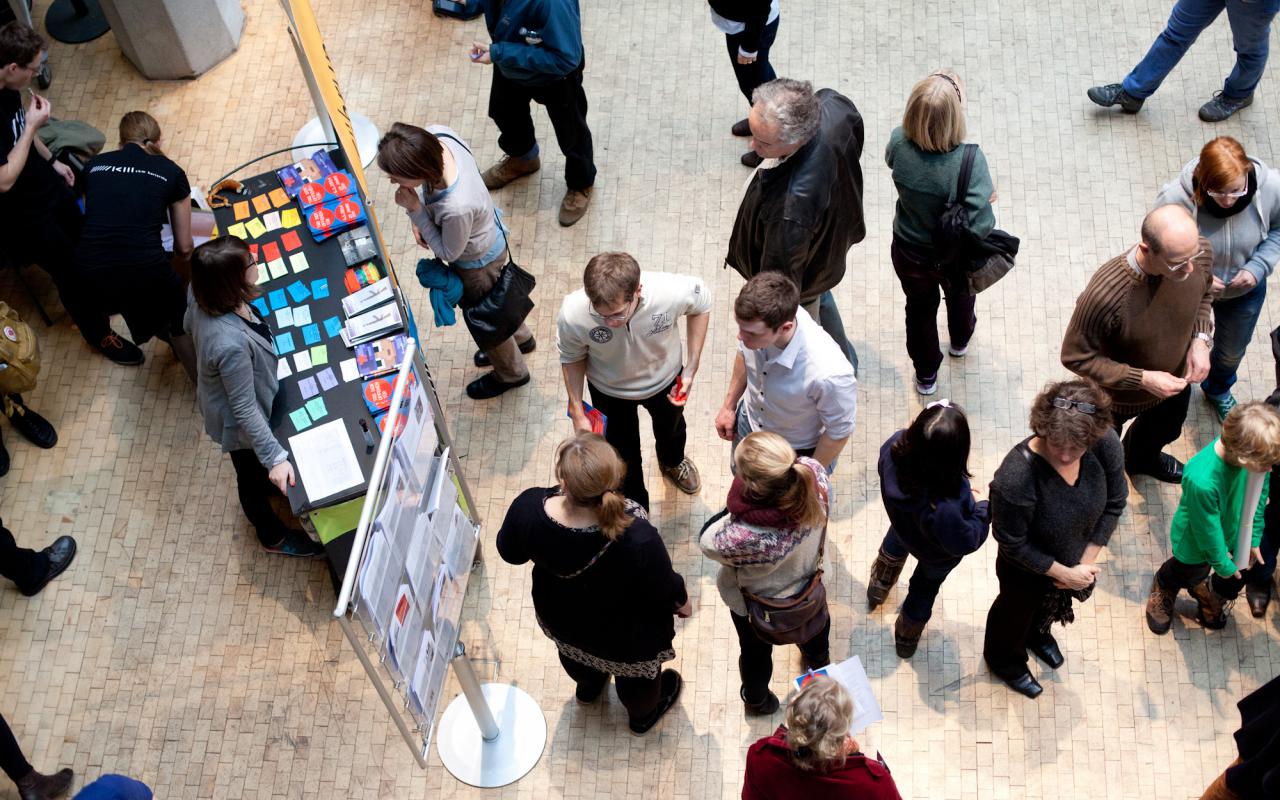 People standing in front of a stand
