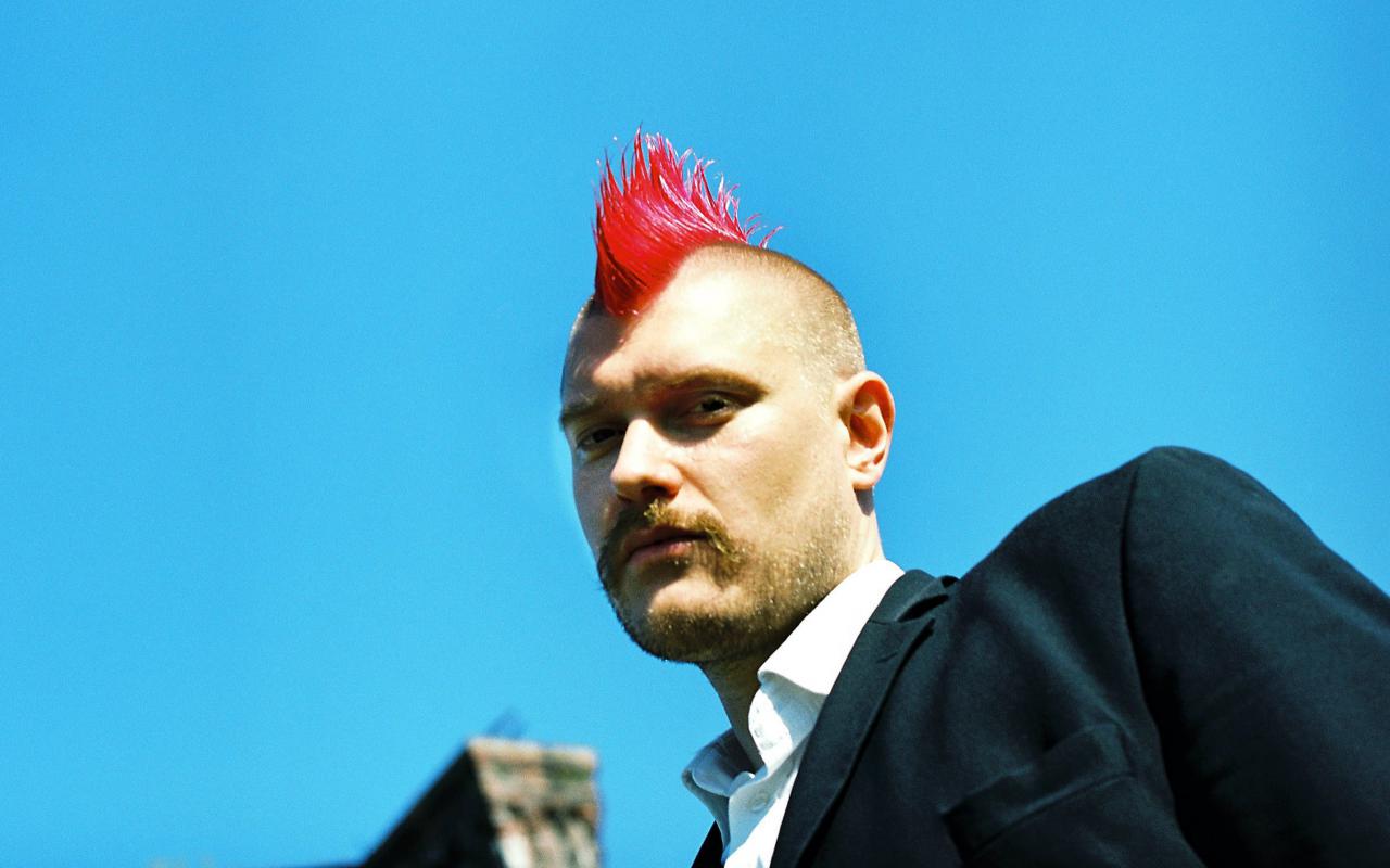 A man with a red mohawk
