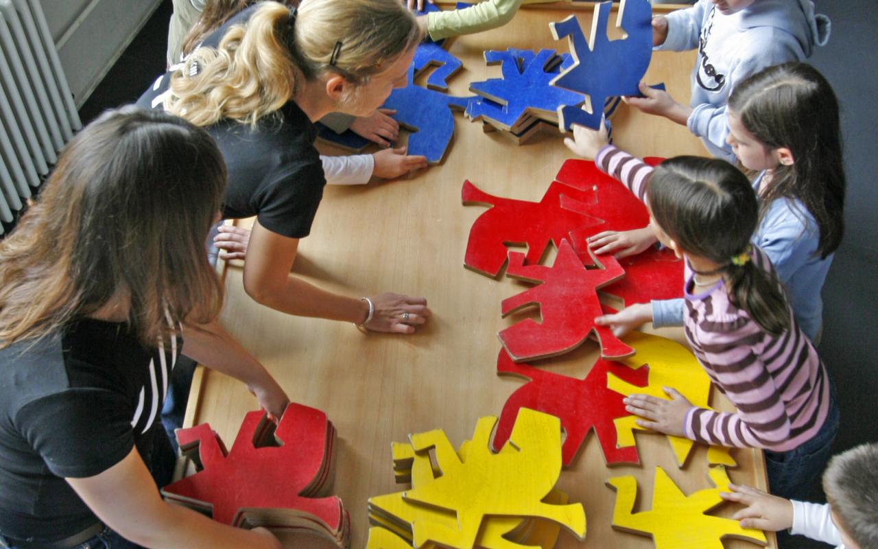 Children playing with puzzle