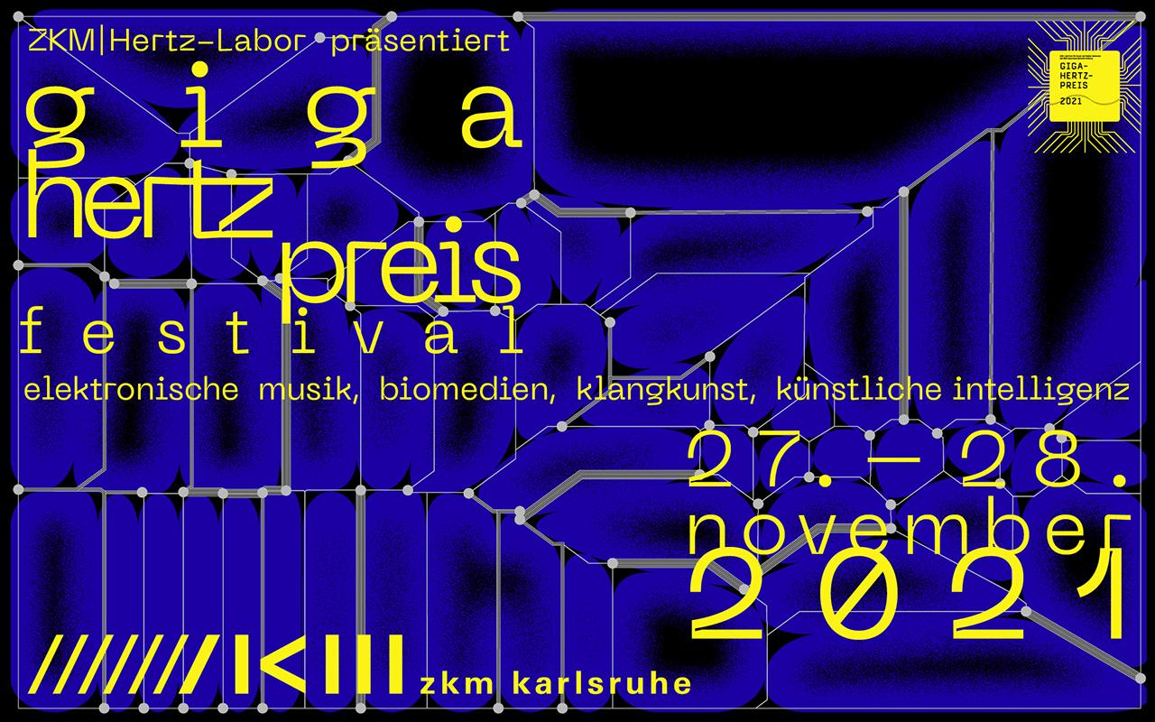 You can see a blue and black poster of the Giga-Hertz Award with gray lines and yellow writing on it. 