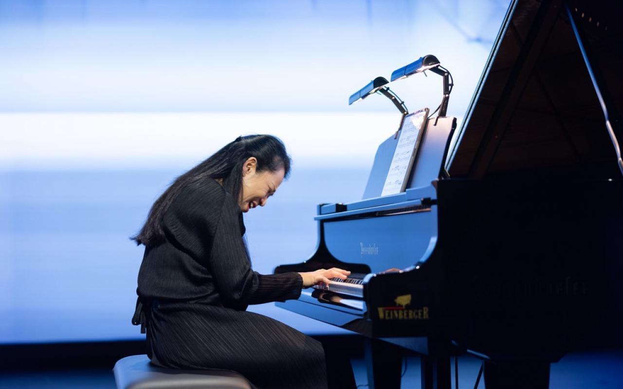 Pianist Maki Namekawa at the grand piano.