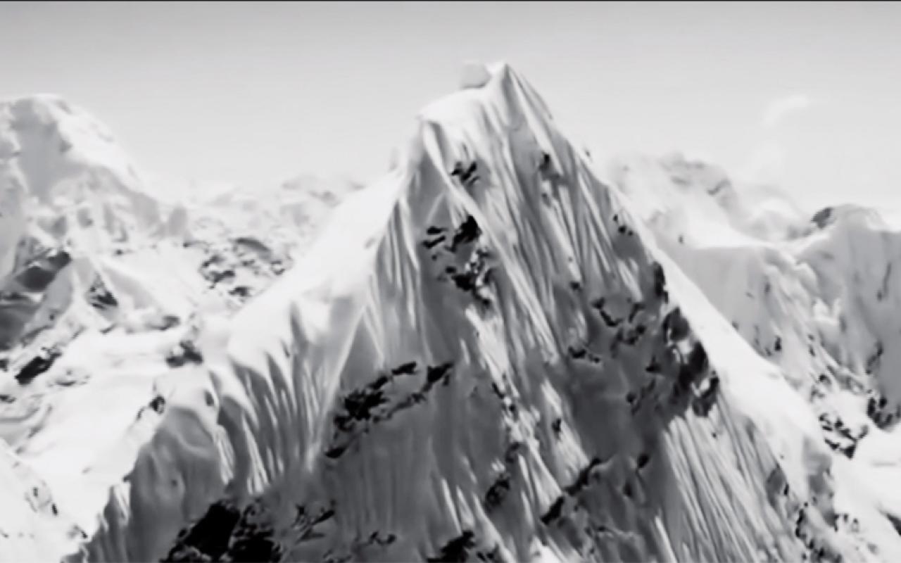 A snow-covered mountain range. Excerpt from the film "Nature" by Artavazd Pelechian