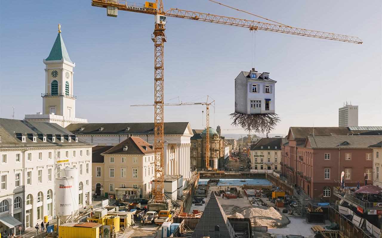 House suspended from a crane