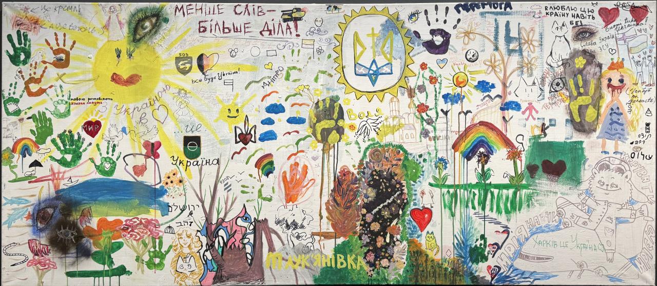 The picture is full of colorful little creations. A yellow, laughing sun dominates on the left, many handprints and a colorful rainbow on the right, as well as flowers, people and hearts.