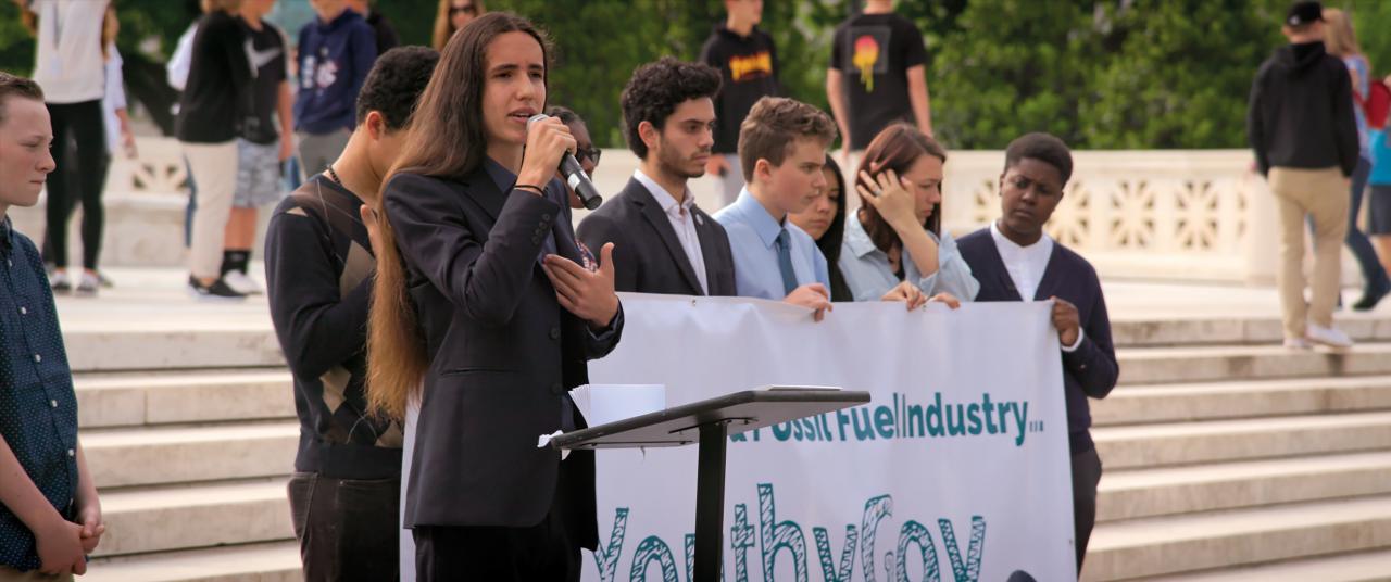 A group of young people gives a public speech for a more environmentally friendly policy