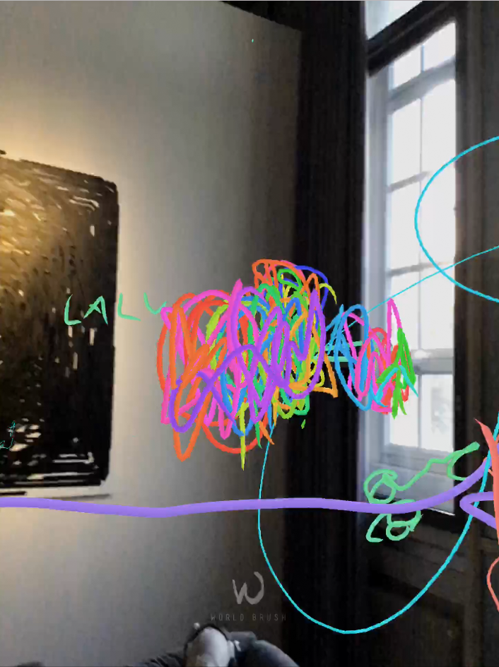  You can see a corner of a room. A ball has been painted into the virtual space with colored pencils.