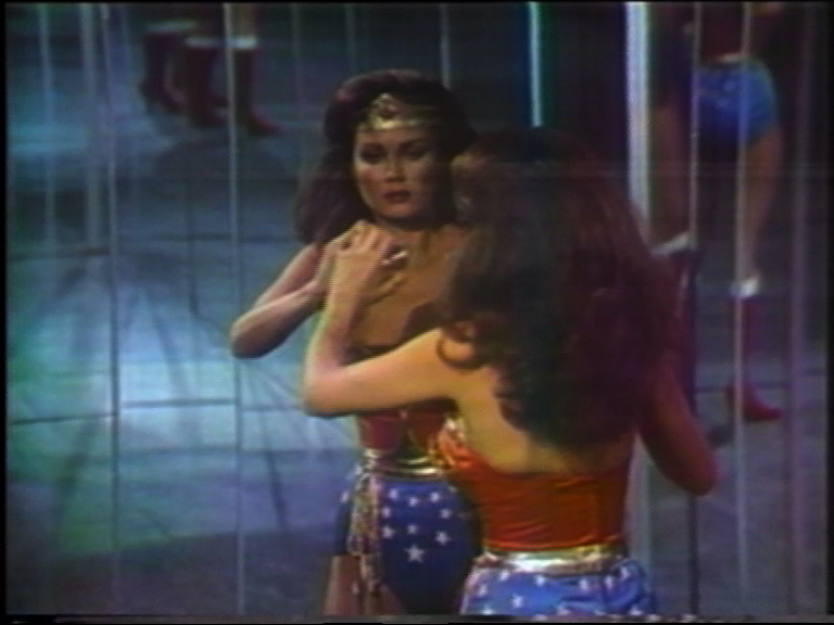 The Super Heroine Wonder Woman looks at herself for the first time in the mirror after her transformation.