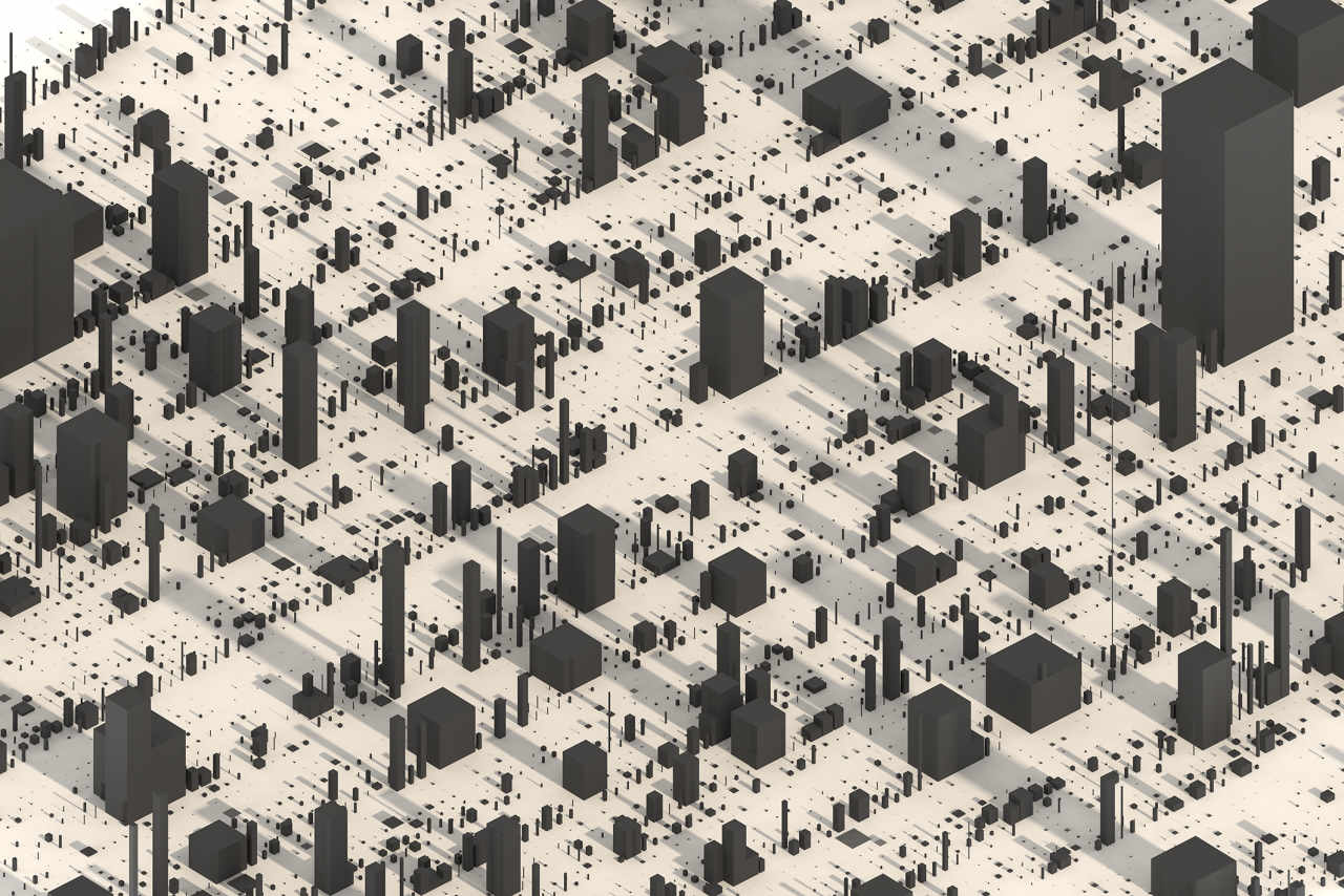 Graue Quader in verschiedenen Größen auf ebener Fläche. Sie sehen aus wie eine Stadt aus Hochhäusern.