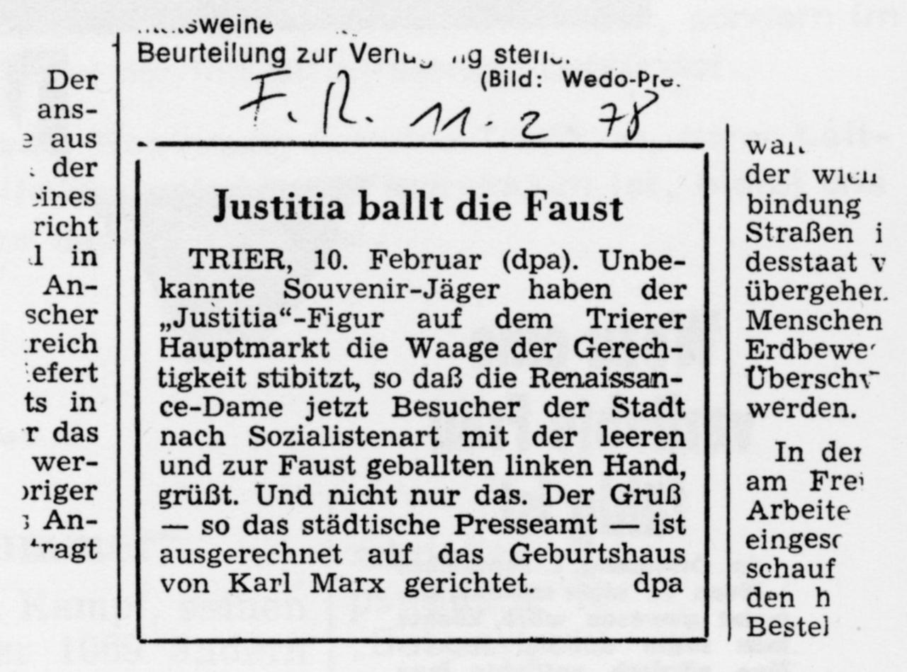 Zeitungsartikel mit der Überschrift: Justitia ballt die Faust