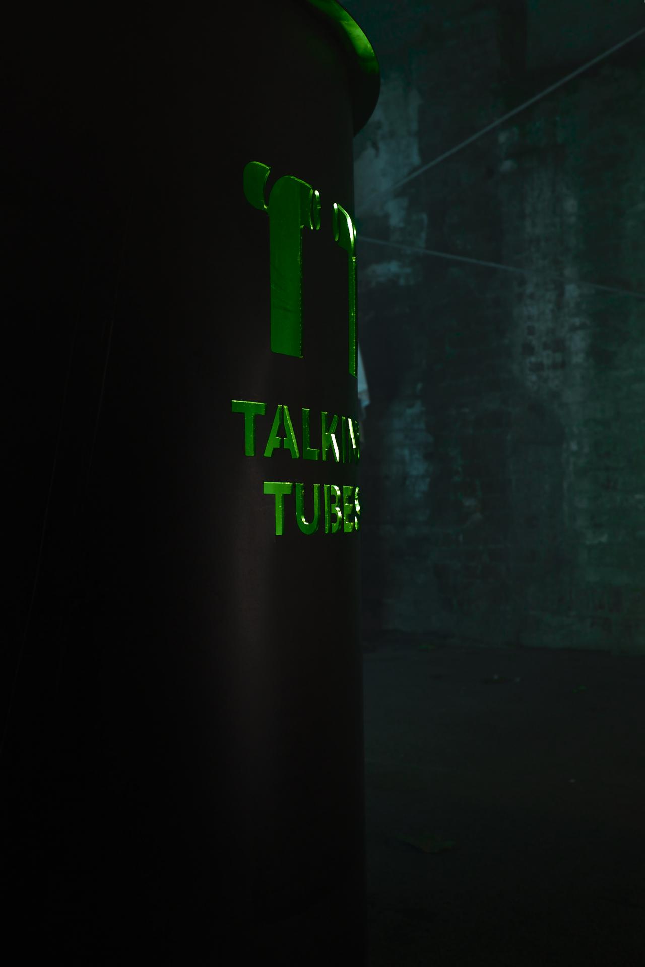 Side view of the control panel of the installation with the inscription »Talking Tubes«