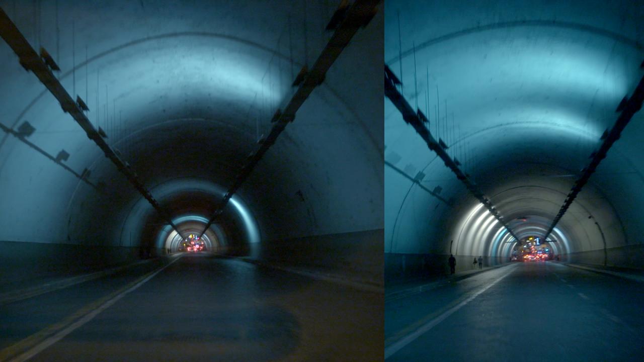 You can see two tunnels. At the end of the tunnel there are red lights. The image is blue, black.