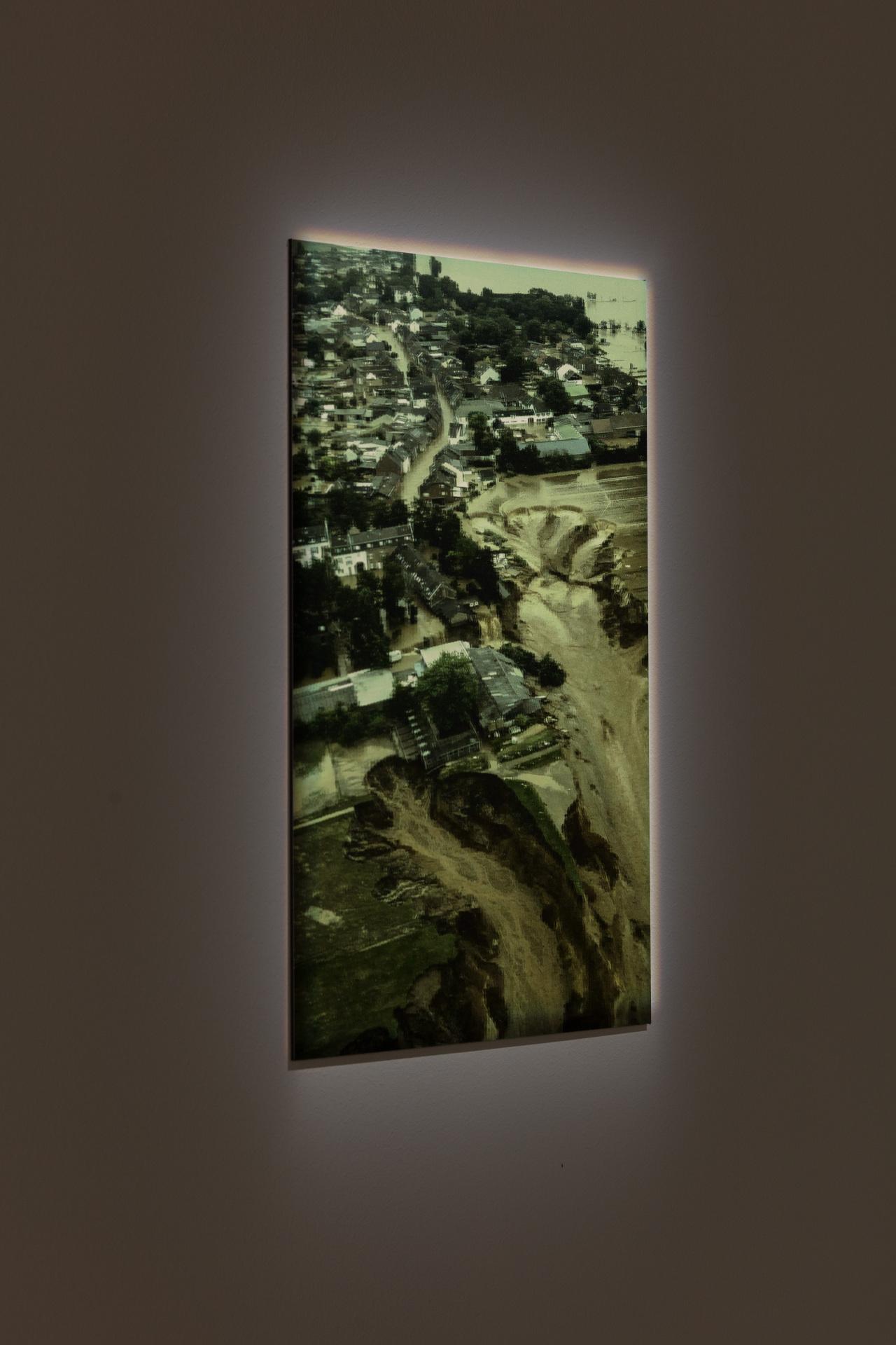 illuminated picture of the flooded city of Erftstadt in North Rhine-Westphalia, hanging on the wall