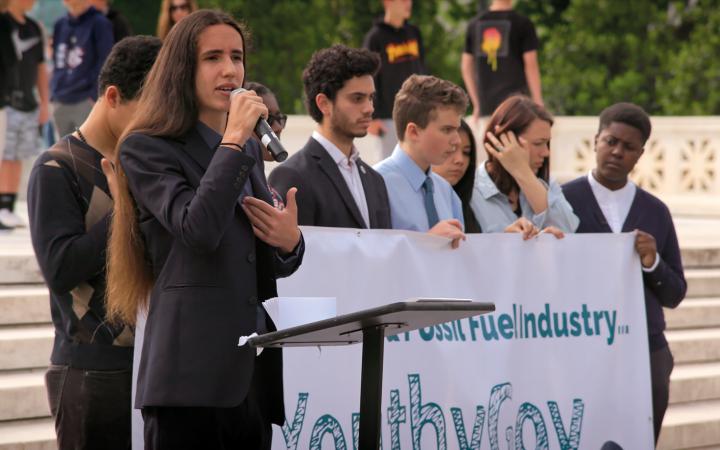 A group of young people gives a public speech for a more environmentally friendly policy