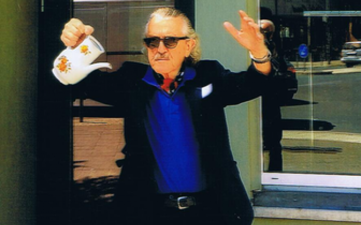 You can see Dieter Meier with a teapot in his hand
