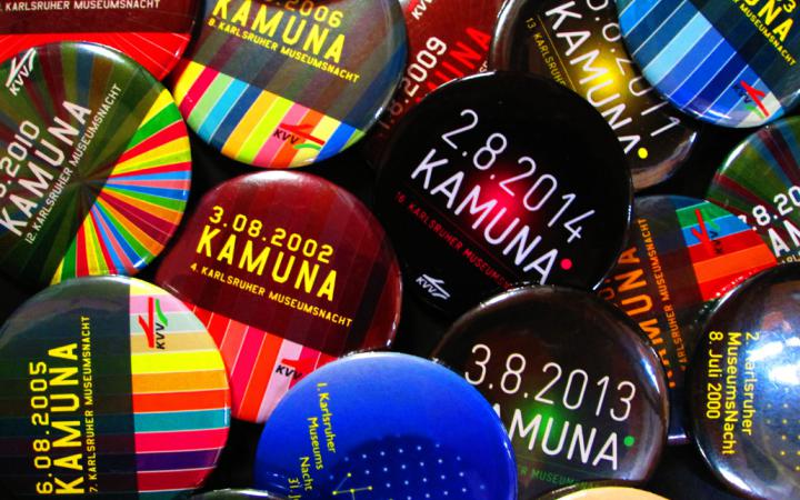 A lot of multi-colored buttons of past KAMUNAs