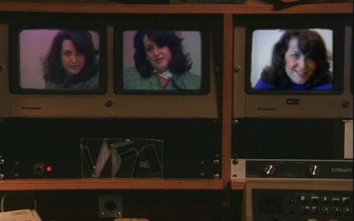 Three old monitors on which a woman, Lynn Hershman Leeson, is shown.