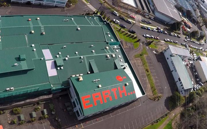 Earth in red letters on a roof