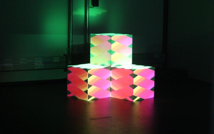 Three stacked colored cubes