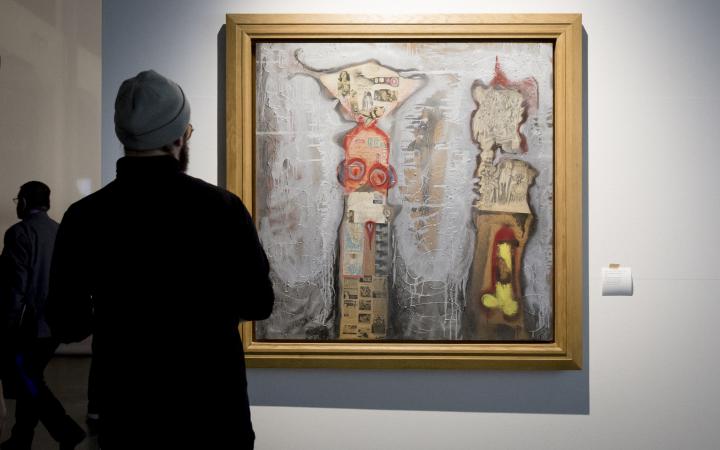 A man looks at a conceptional painting