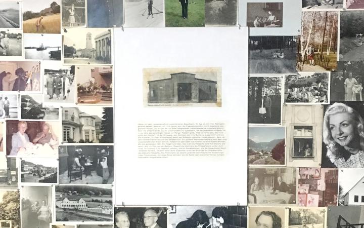 Wall covered with photos, on top of which a text board