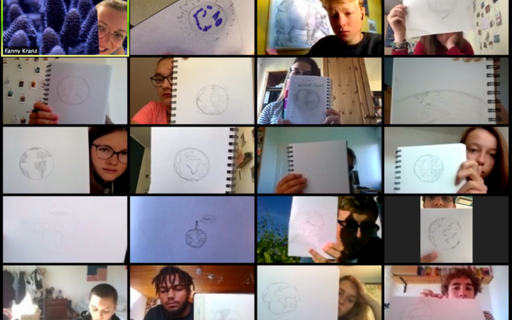 Screenshot of a Zoom call with the participants of the Cultural academy Baden-Württemberg, who are holding up their drawings of planet Earth