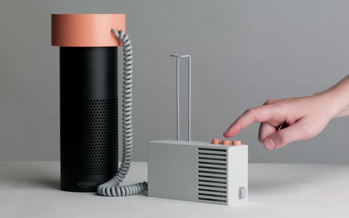 Photo of »Object B – Kidding Alexa« of the work »Accessories for the Paranoid«, Amazon's Alexa is connected to an apparatus with buttons.